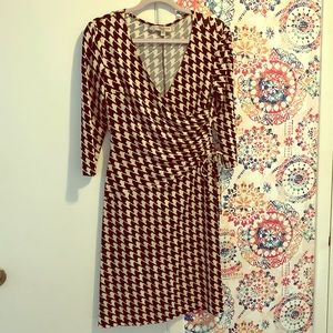 Flattering houndstooth faux wrap dress